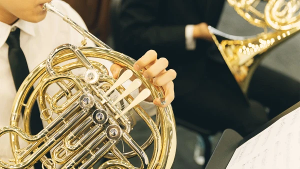 two students playing french horns at tianjin international school