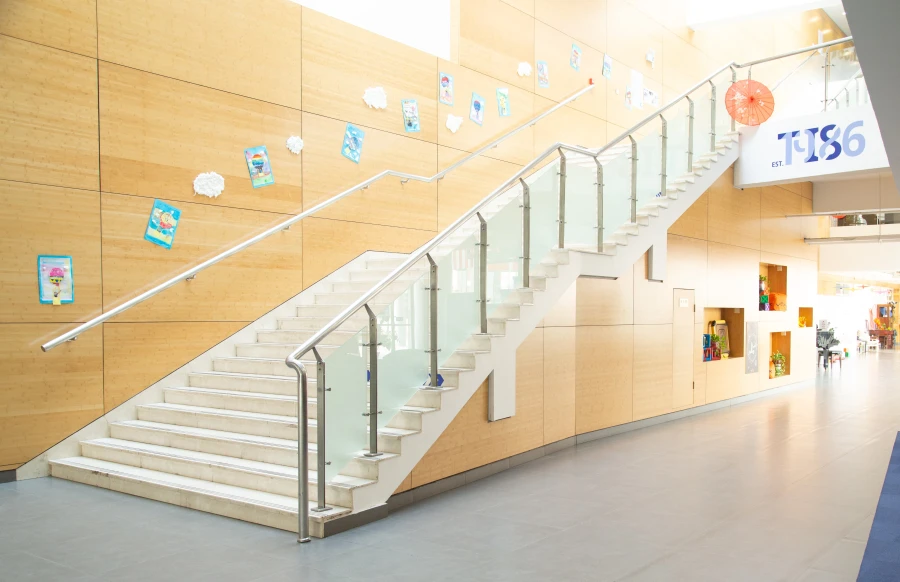 the big staircase in the front lobby of tianjin international school campus