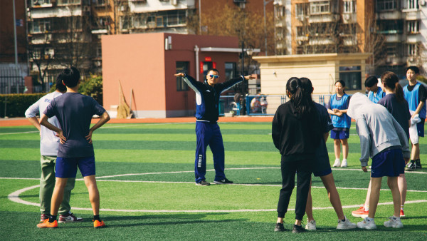 tianjin international school teachers in physical education class instructing track and field