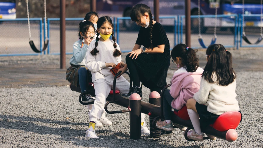 six female students playing outside tianjin international school elementary department
